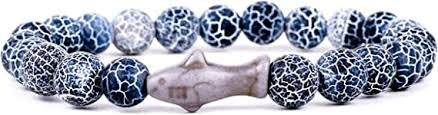 A beaded bracelet featuring dark blue and white crackled stone beads with a central gray fish-shaped bead, shown on a plain white background.