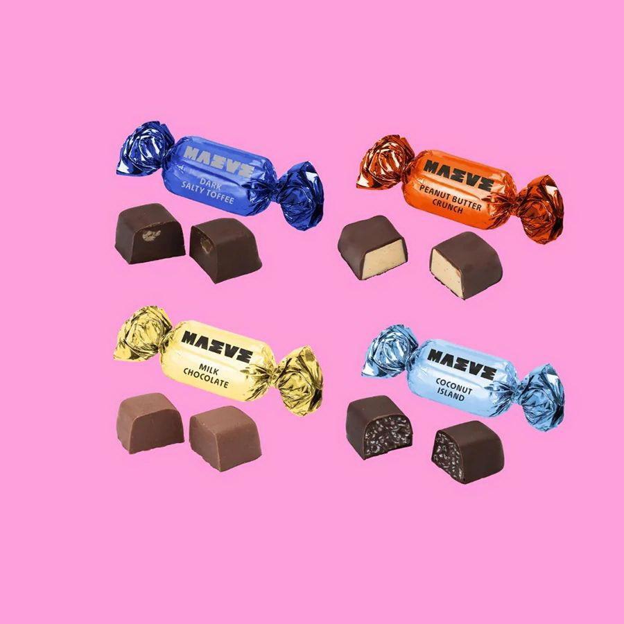 Assorted Máeve chocolates on a pink background