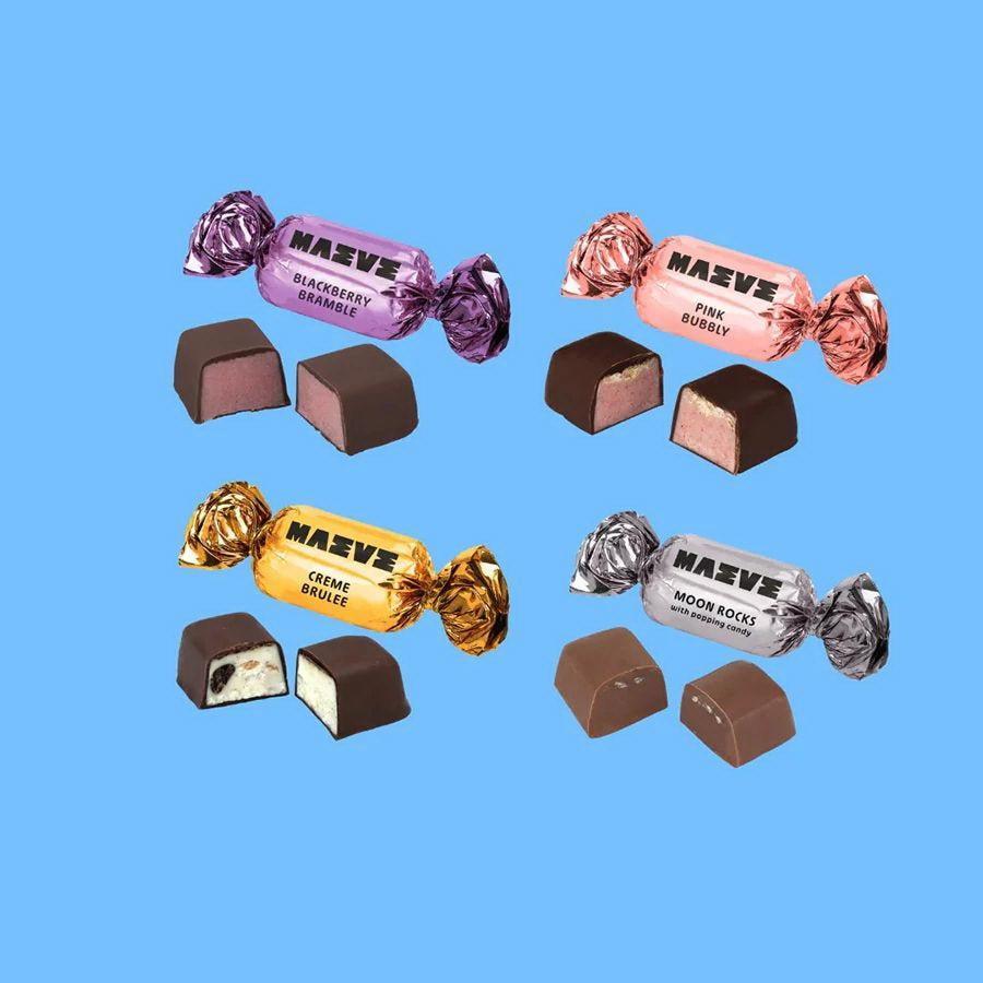 Assorted Máeve candies in different flavors on a blue background