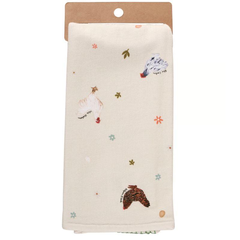 Baby blanket with chicken pattern on a cardboard backing