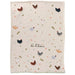 Blanket with chicken pattern and text 'On the love of chickens' on a white background