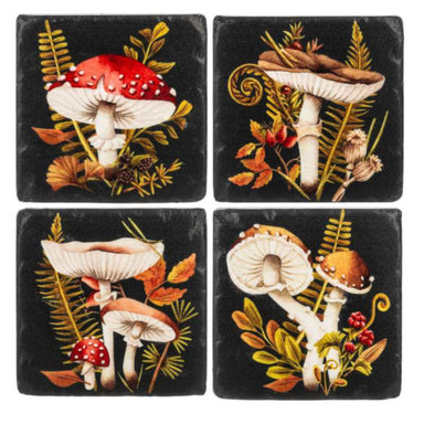 Four square coasters with mushroom and leaf designs on a black background