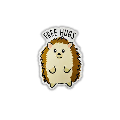 A die-cut sticker featuring a cute cartoon hedgehog with the words 'FREE HUGS' above it, shown on a plain white background.