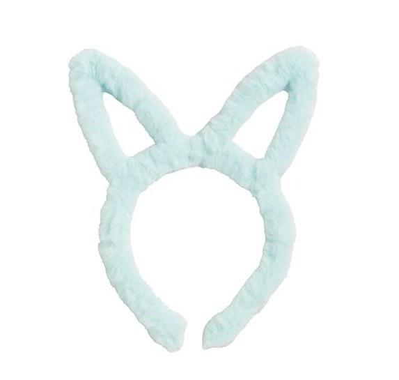 Light blue bunny ear headband on a white background