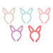 Set of five pastel-colored cat - bunny ear headbands on a white background