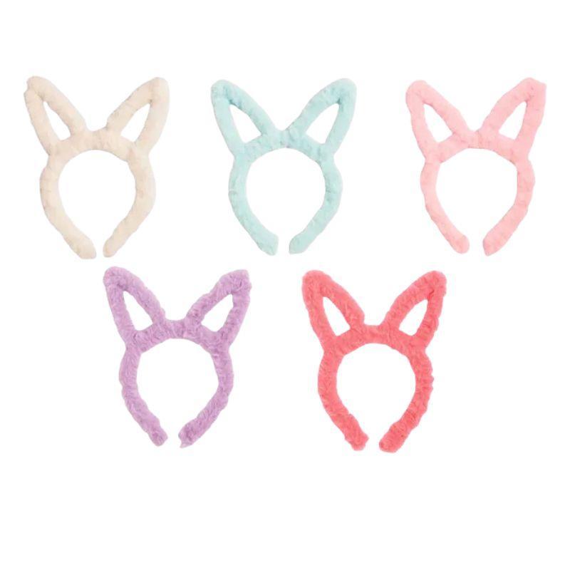 Set of five pastel-colored cat - bunny ear headbands on a white background