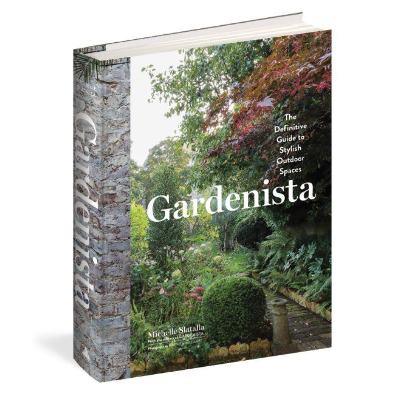 Book titled 'Gardenista' with a garden scene on the cover
