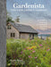 Book cover of 'The Low-Impact Garden' by Kendra Wilson with a scenic house and garden.