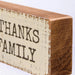 Wooden block with 'THANKS FAMILY' text on a white background