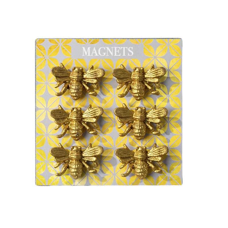 Gold bee-shaped magnets on a patterned card with 'MAGNETS' text.