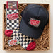 Box containing a navy cap and checkered socks with 'Grumpy Old Man' branding.