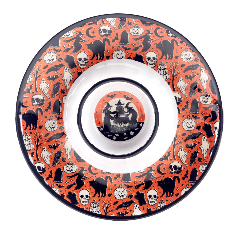 A round Halloween-themed melamine plate with a white center and a vibrant orange rim decorated with black and white spooky illustrations including skulls, cats, ghosts, pumpkins, and a haunted house.
