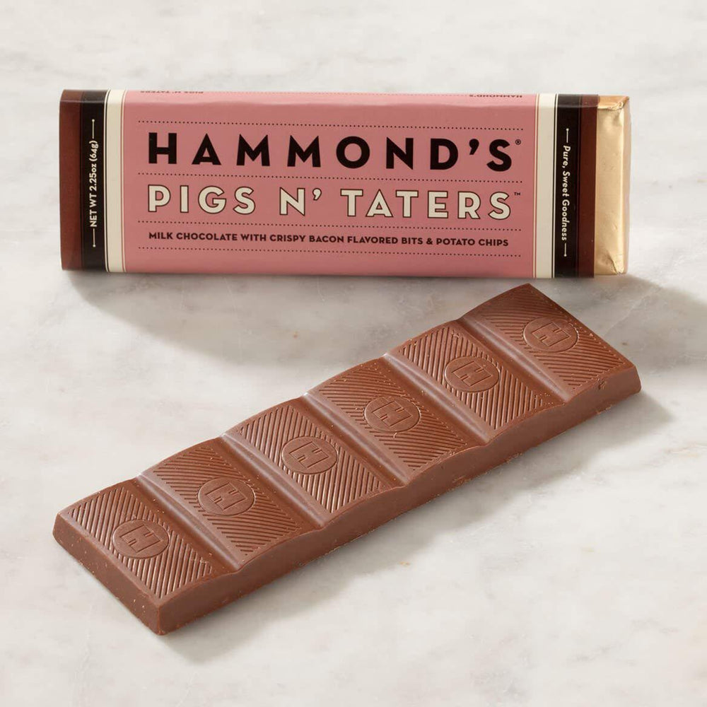 Chocolate bar with 'Hammond's Pigs N' Taters' packaging on a light background