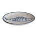 Ceramic plate with blue fish design on a white background