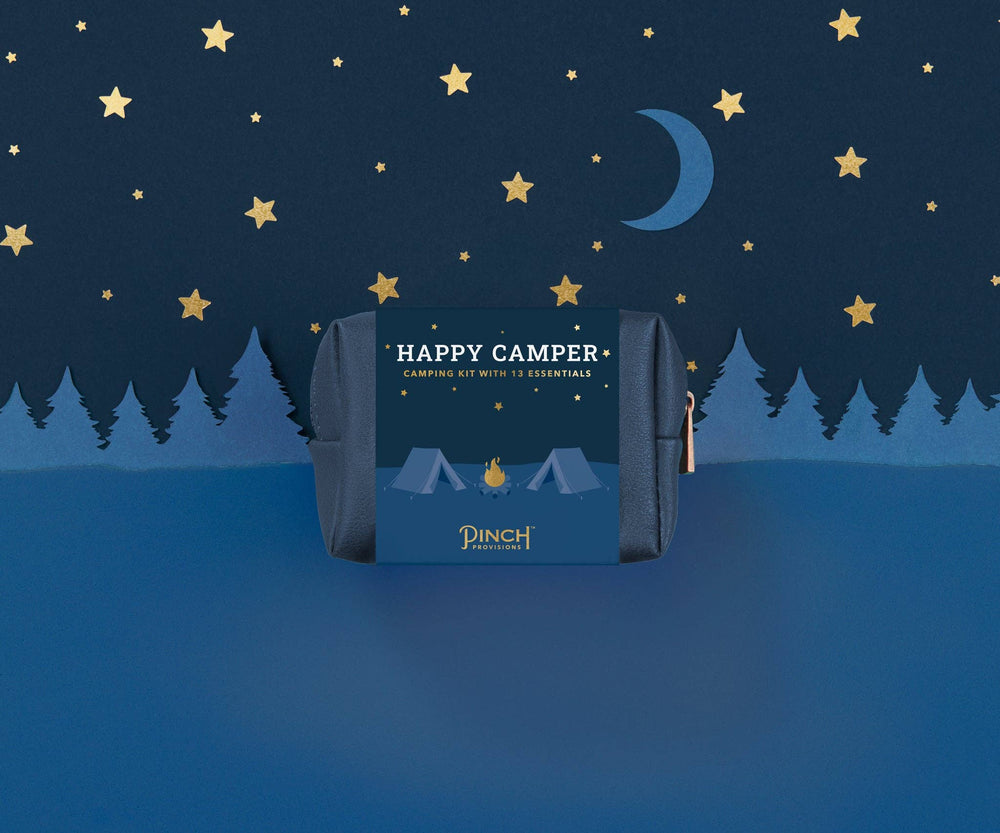 Camping kit packaging with 'Happy Camper' text against a night sky with stars and moon background.