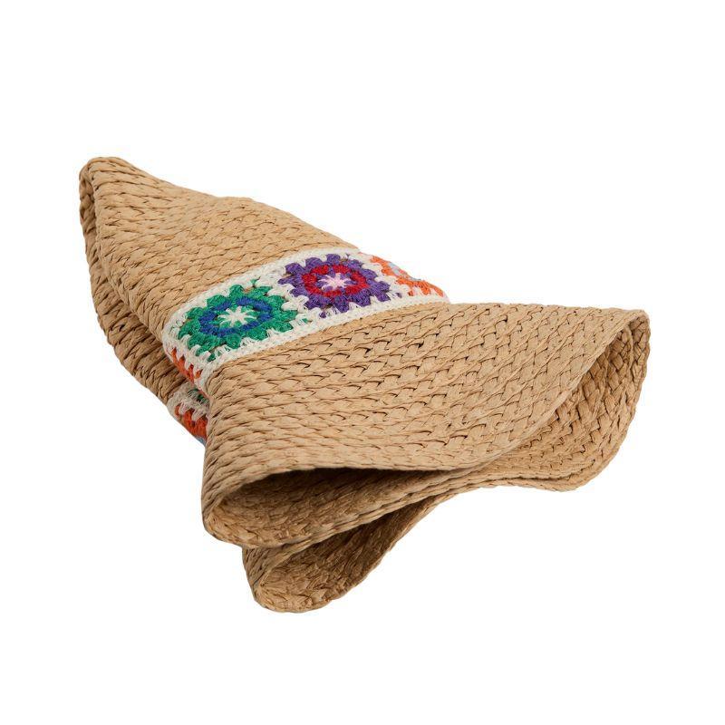 Woven straw hat with colorful band on a white background