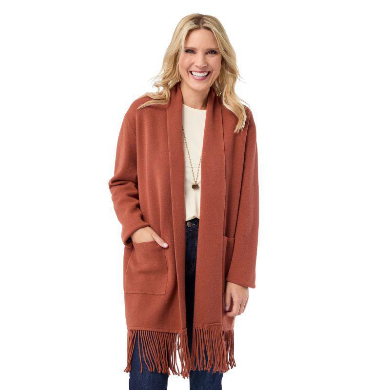 Woman wearing a brown cardigan with fringe on a white background