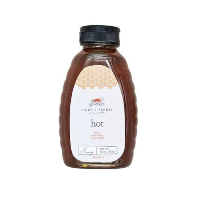 Bottle of honey with a label on a white background