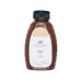 Bottle of honey with a label on a white background