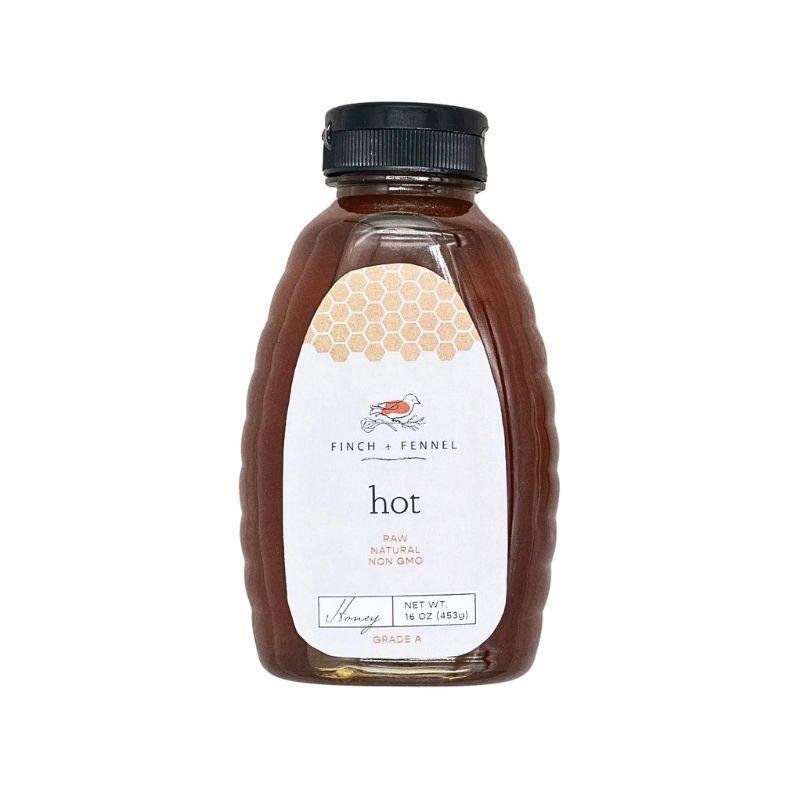 Bottle of honey with a label on a white background