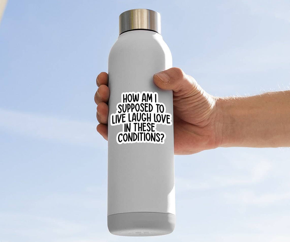 Person holding a white water bottle with a motivational quote on a clear blue sky background