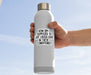 Person holding a white water bottle with a motivational quote on a clear blue sky background