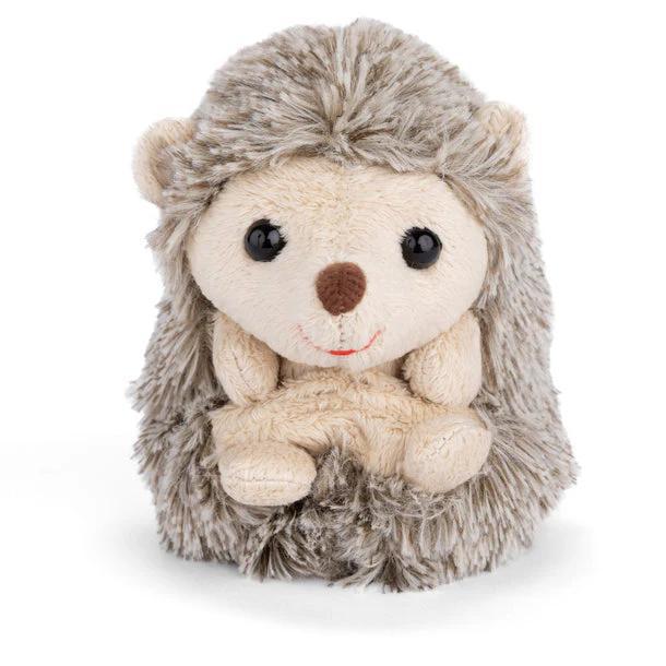 Plush toy hedgehog with a white face and brown nose on a white background