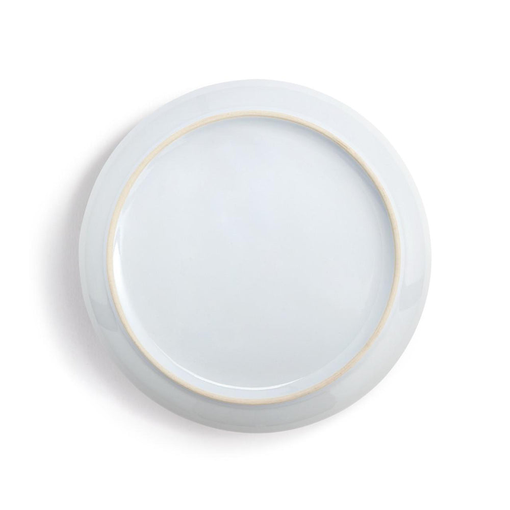 White plate with a thin gold rim on a white background