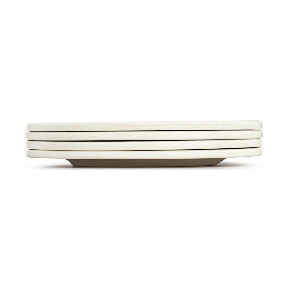 Set of white ceramic plates stacked on a white background