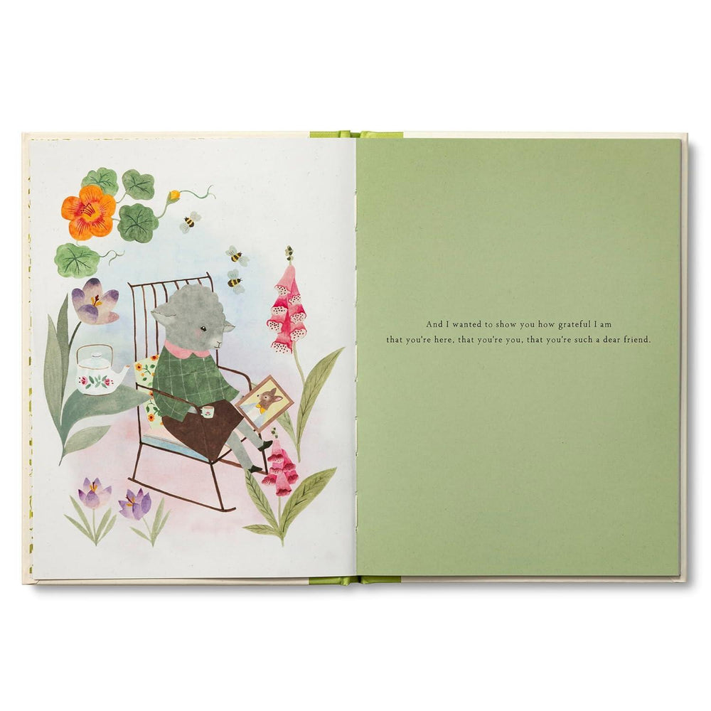 Open book with illustrations of a cat, flowers, and text on a white background