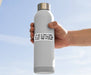 Person holding a white water bottle with a humorous label against a clear blue sky
