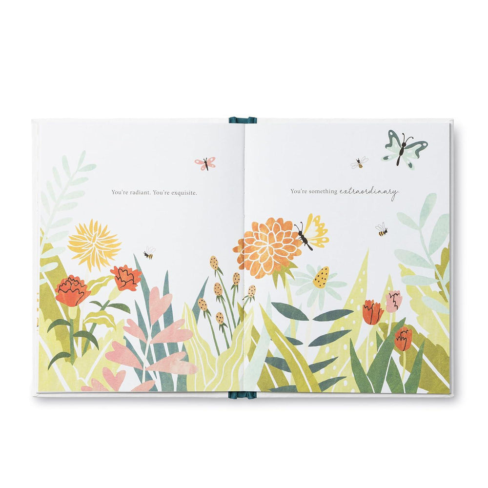 Open book with floral illustrations and text on a white background