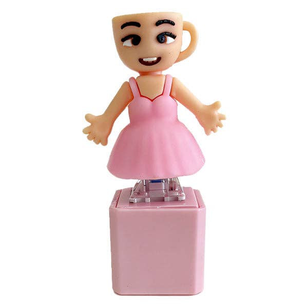 Toy figure with a pink dress on a white background