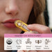 Person applying a yellow Moon Organics lip balm with product details below.