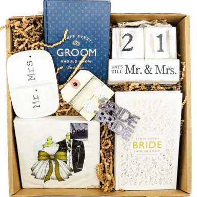 "Just Engaged" Treasure Gift Box! that includes a countdown to Mr & Mrs calendar Block, a Mr & Mrs Ring Dish, themed Napkins, "Stuff Every Bride Should Know" book, "Stuff Every Groom Should Know" book and a pair of Bride Earrings
