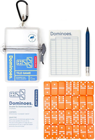 Dominoes tile game set with dice, rules, and pencil on a white background