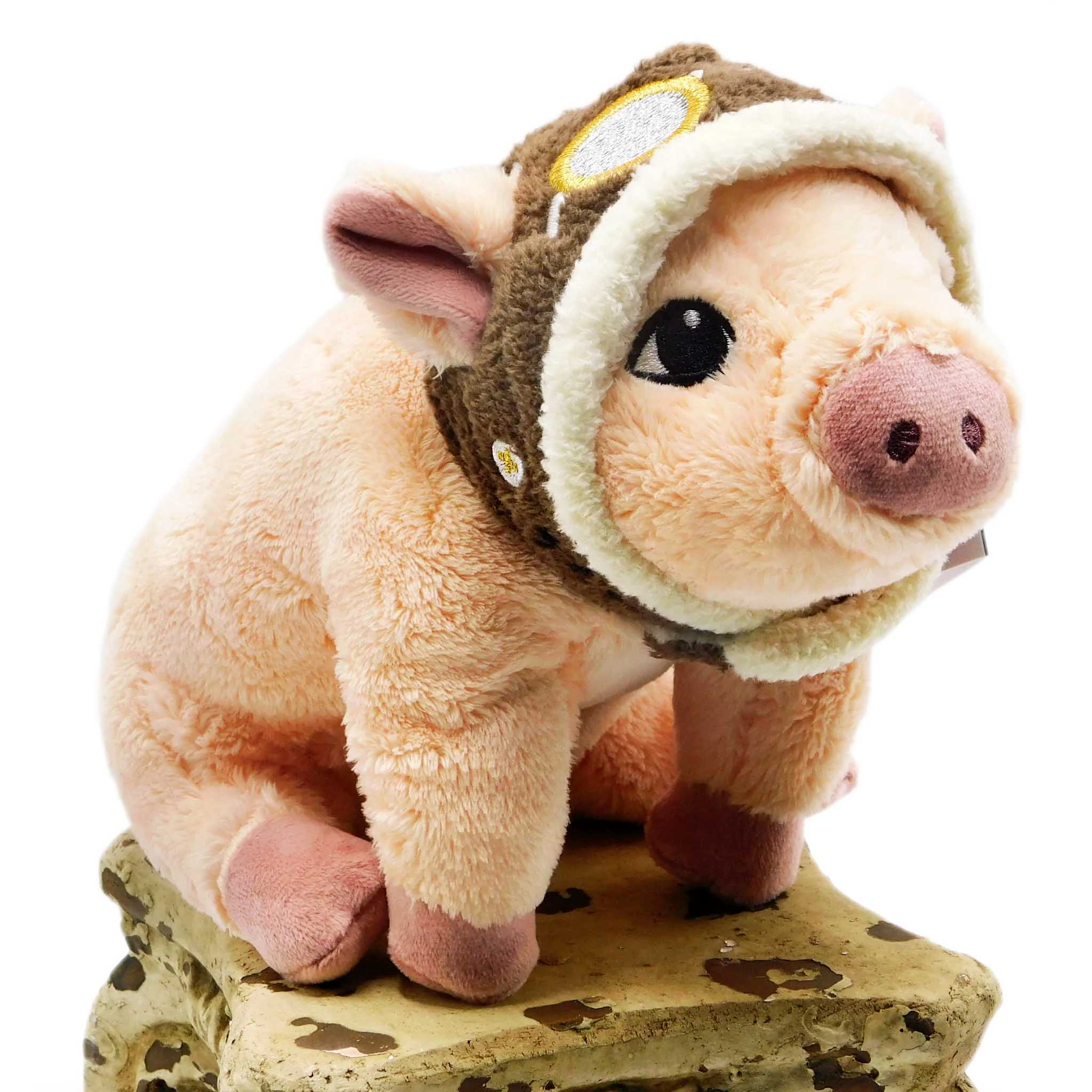 a cute little pink plushie piglet wearing an aviators hat. 