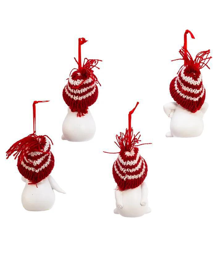 Set of four small snowman figurines with red and white striped hats on a white background