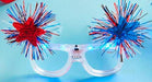 Glasses with red and blue decorative fireworks on a blue background