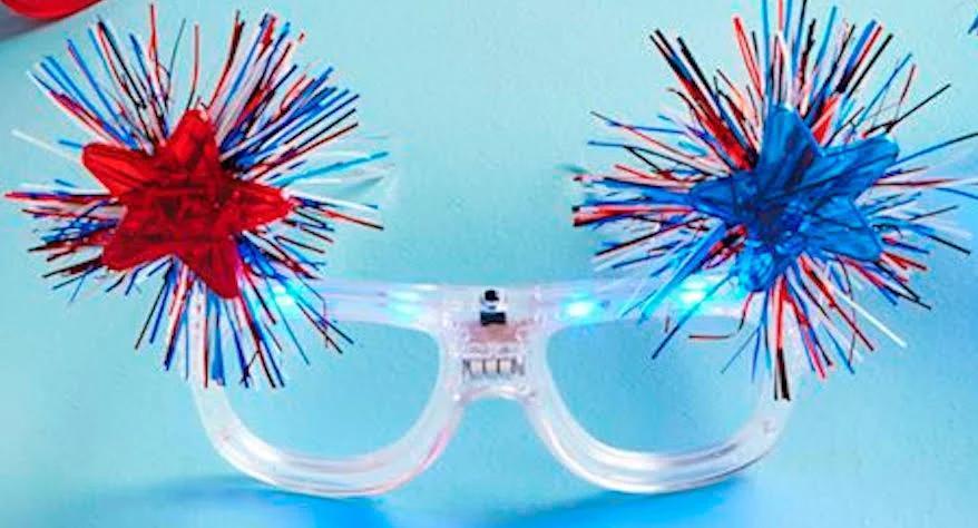 Glasses with red and blue decorative fireworks on a blue background