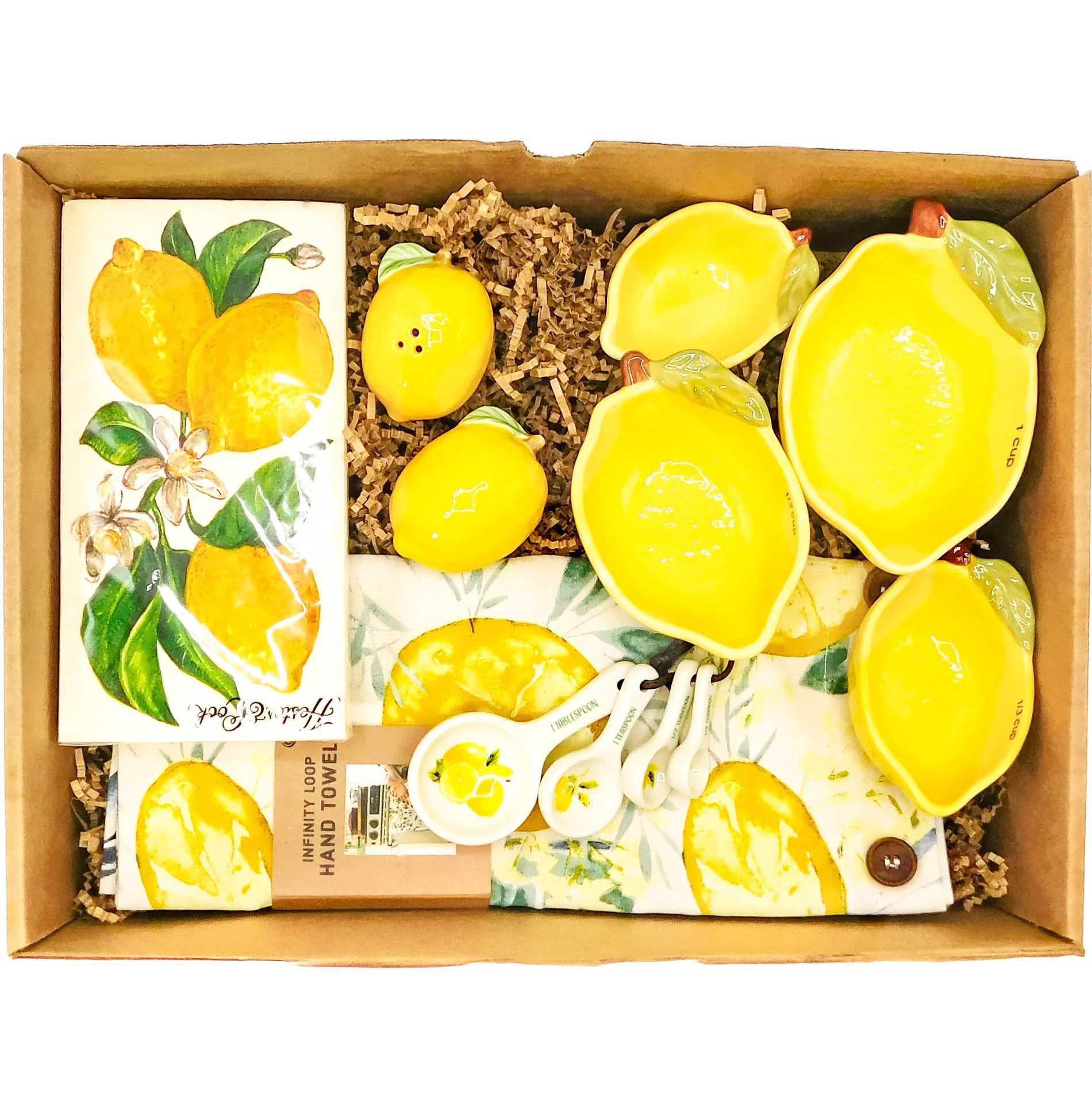 delightful "Lemon Housewarming" Treasure Gift Box that contains: 4 ceramic measuring spoons, 4 cute lemon-shaped measuring cups made out of durable ceramic,  salt & pepper shakers shaped like juicy lemons, lemons napkins  and a cute lemons infinity kitchen towel 