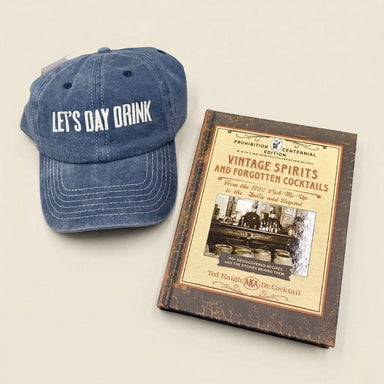 Blue cap with 'Let's Day Drink' text and a book titled 'Vintage Spirits and Forgotten Cocktails' on a light background