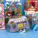 Collection of colorful candy boxes with festive designs on a blue background