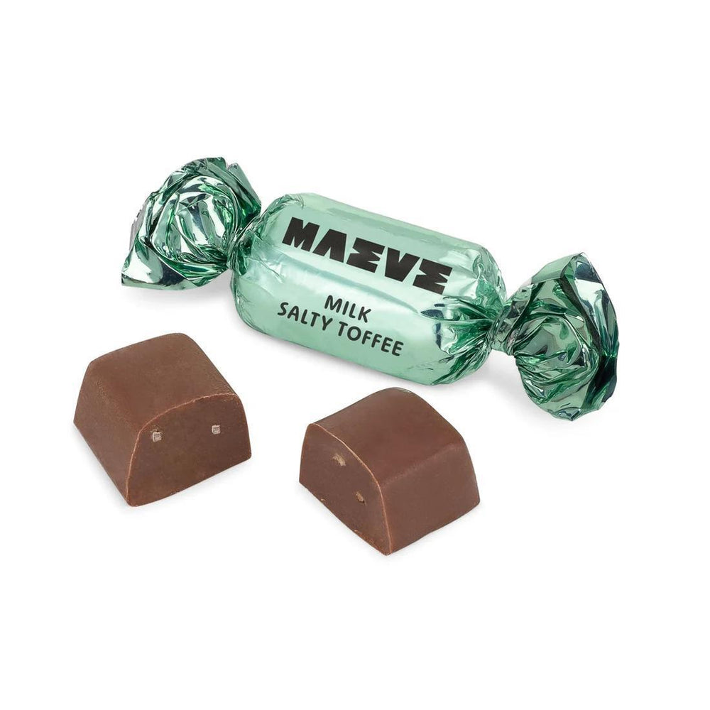 Milk salty toffee candy with green wrapper on a white background