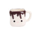 Ceramic mug shaped like a cartoon character with chocolate sauce on top against a white background