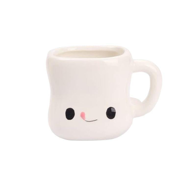 White mug with a smiley face design on a white background
