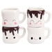 Set of four mugs with cartoon faces, two stacked vertically and two horizontally.