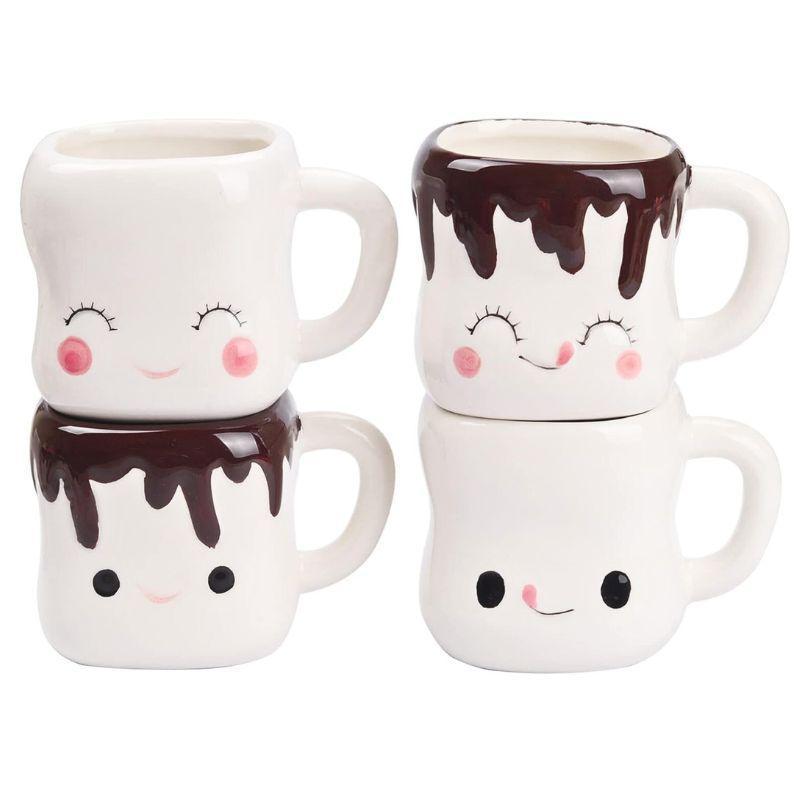 Set of four mugs with cartoon faces, two stacked vertically and two horizontally.
