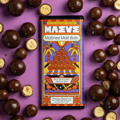 Matinee Malt Balls chocolate bar packaging with truffles on a purple background