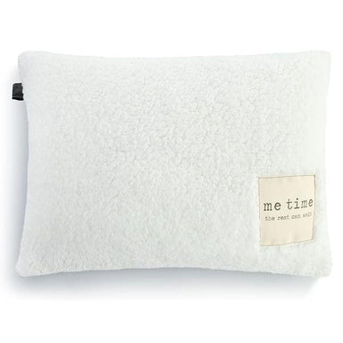 White textured pillow with a label on a white background